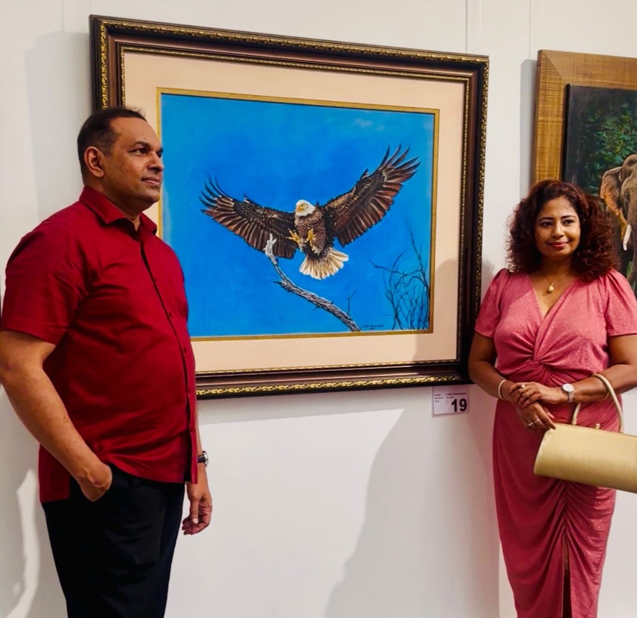 The artists with the painting Descent at the Lionel Wendt Gallery